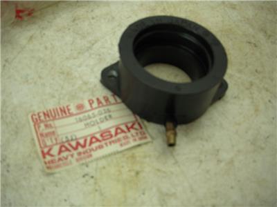 16065-036 1976-80 KZ750 B M TWIN KAWASAKI NOS MANIFOLD CARBURETOR CARB HOLDER (RED150)